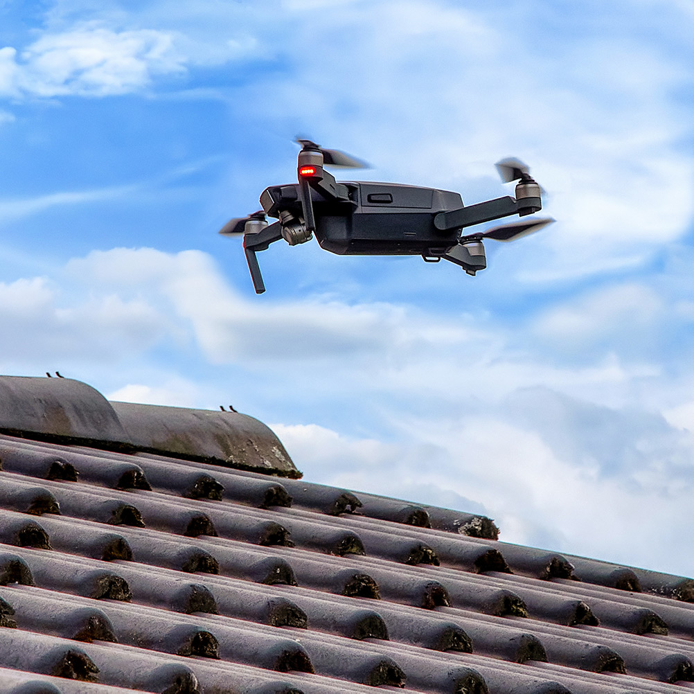 Drone flying over roof