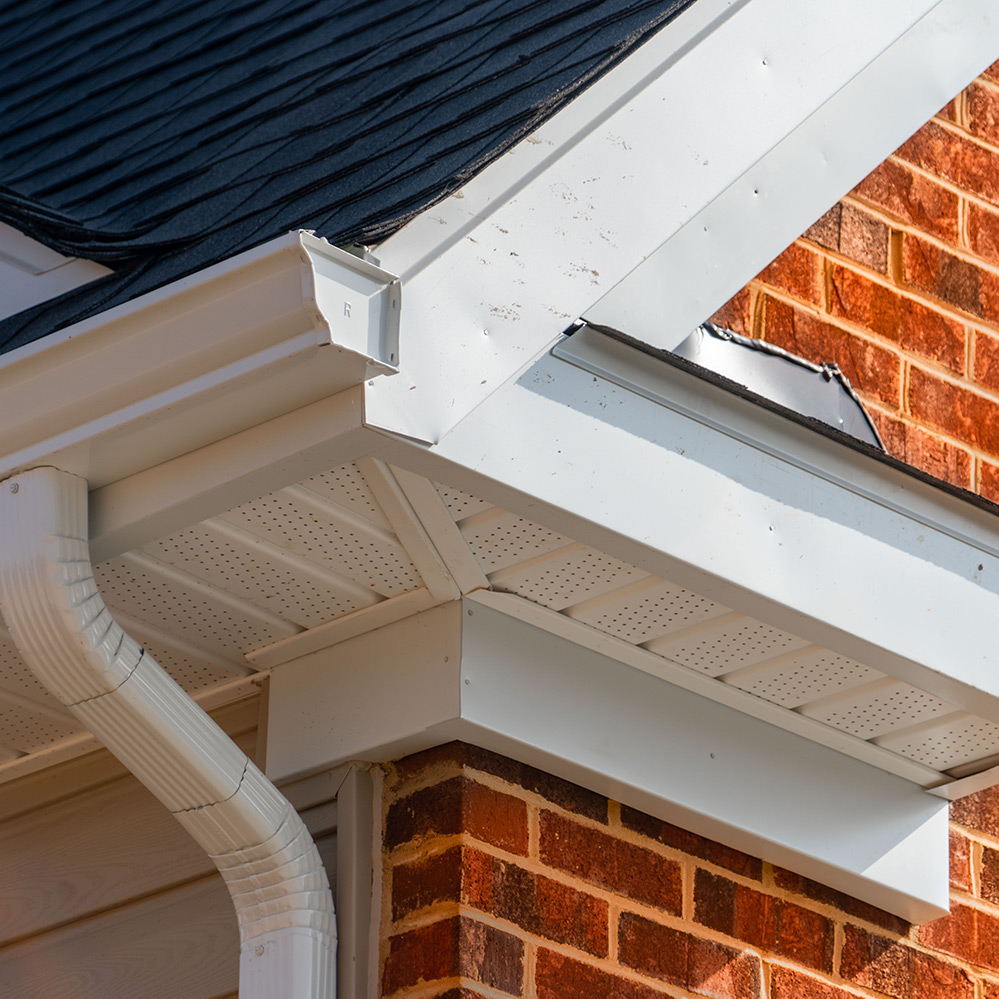 White roof soffit with drain pipe